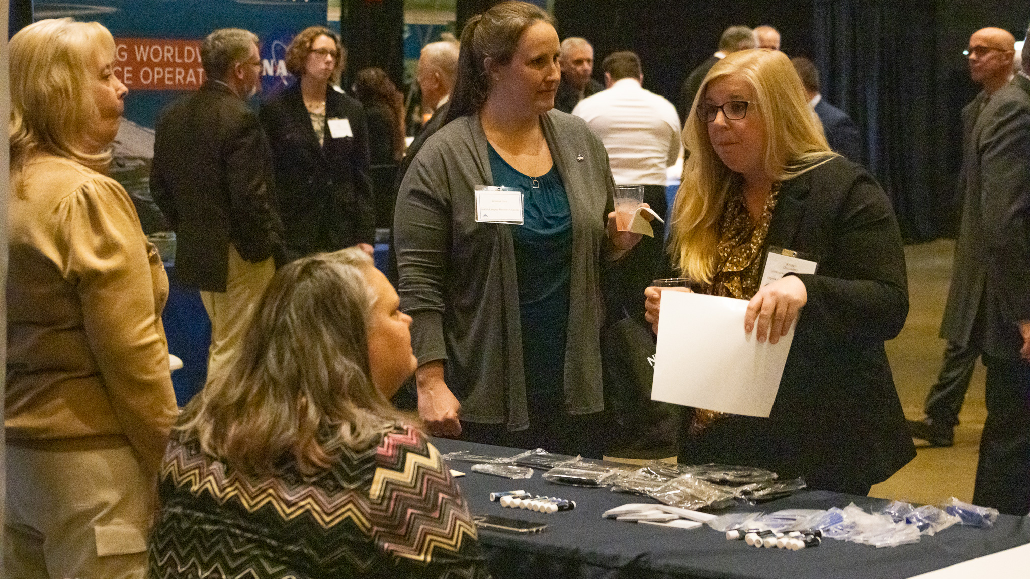 SSAI was one of 50 exhibitors. Pamila Ashworth, Cassie Lehnhardt, and Kristina Cors are seen here interacting with a fellow attendee.
