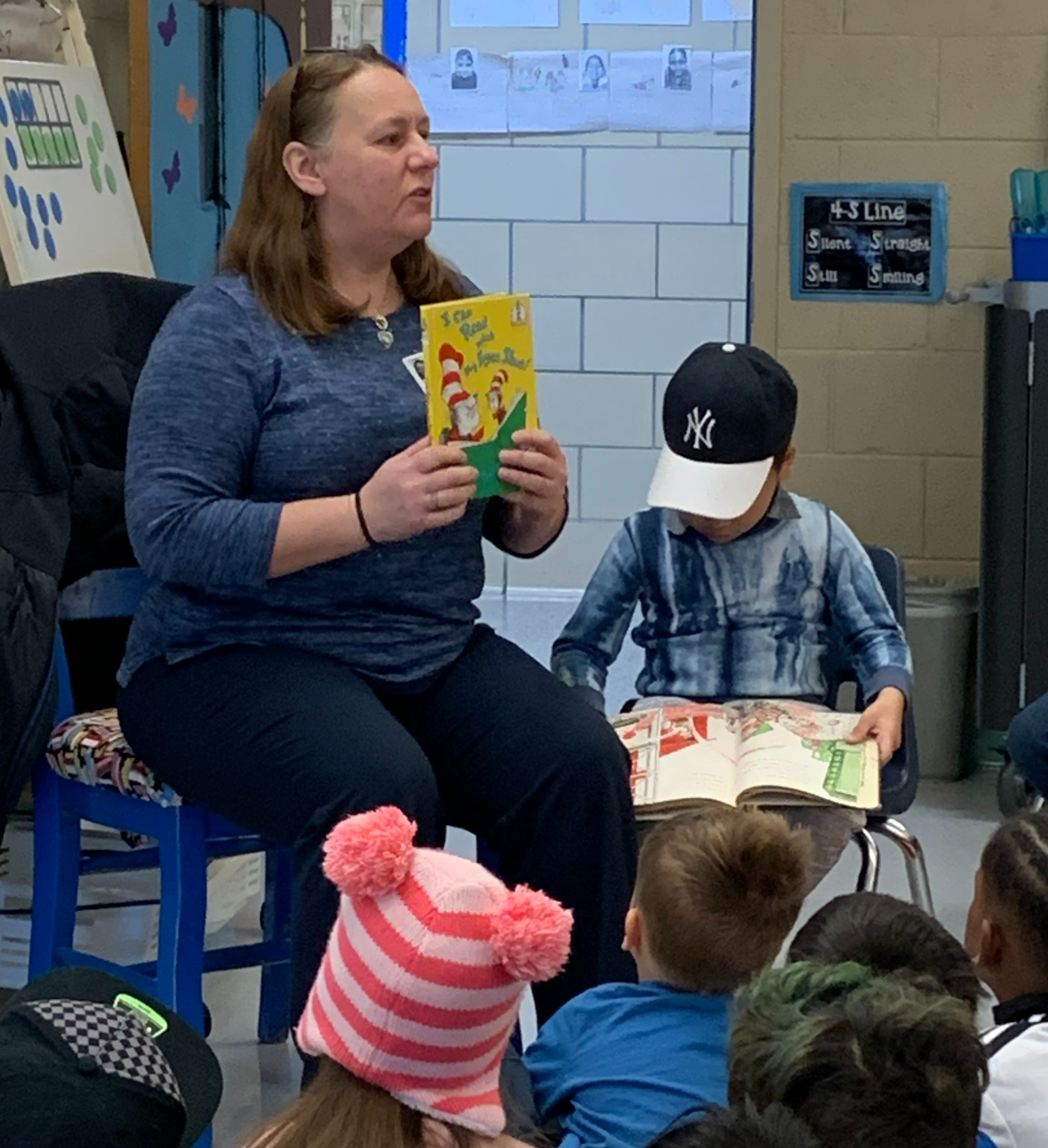 SSAI's Jennifer Tindell reads to students in honor of Dr. Seuss's birthday at our partner elementary school 